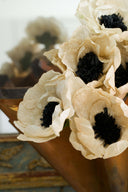 Dual-colored vintage-inspired crepe paper flowers. Handmade Christmas and seasonal ornaments in beige, black, brown, and white