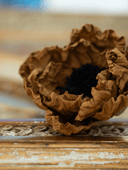 Dual-colored vintage-inspired crepe paper flowers. Handmade Christmas and seasonal ornaments in beige, black, brown, and white