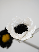Dual-colored vintage-inspired crepe paper flowers. Handmade Christmas and seasonal ornaments in beige, black, brown, and white