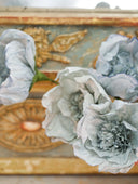 Handmade and hand-dyed crepe paper flowers in solid colors. Bouquets of paper flower Christmas ornaments in blue, white, and pale pink